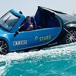 1. futuristic blue yacht-like vehicle for luxury water rides in Dubai.